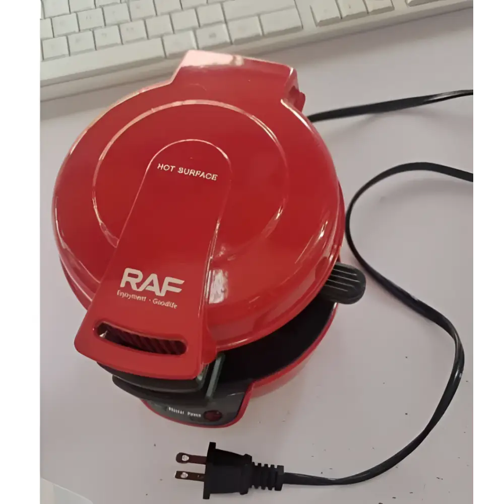 Red raf electric hamburger maker with glossy finish and black power cord for egg toasting and waffle making