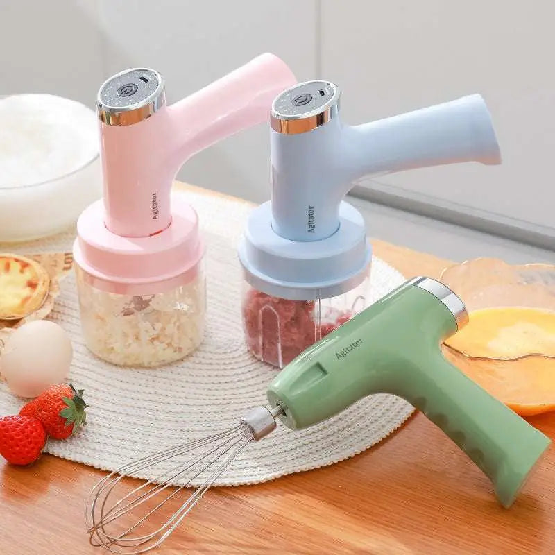 Pastel pink and light blue electric hand whisk and food processor set with clear containers and green whisk attachment features speed settings
