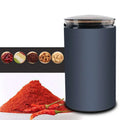 Dark gray electric herb grinder with transparent base designed for grinding herbal coffee with a clear lid