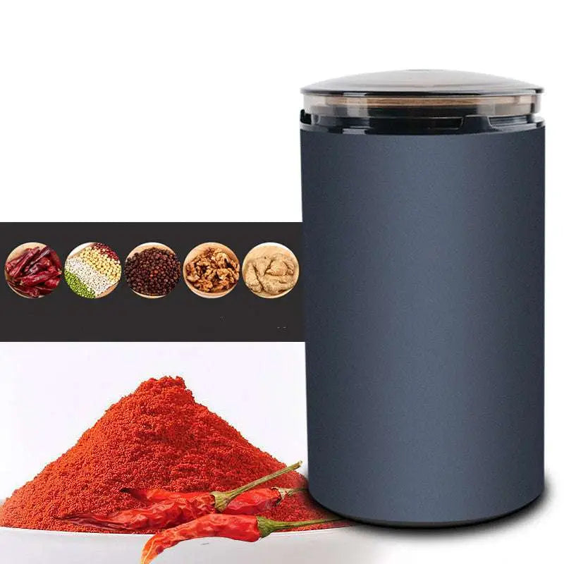 Dark gray electric herb grinder with transparent base designed for grinding herbal coffee with a clear lid