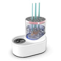 White electric makeup brush cleaner with transparent cylindrical chamber, pink accent ring, and digital control panel
