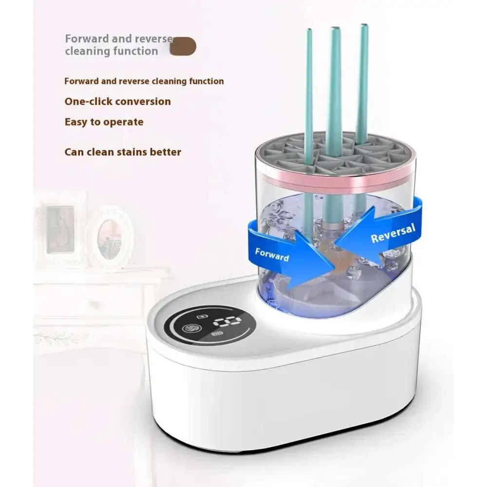 White electric makeup brush cleaner with transparent design and pink accents holding three teal brushes upright