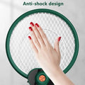 Green circular electric mosquito swatter with white mesh grid and orange button featuring mosquito trap mode for effective insect control
