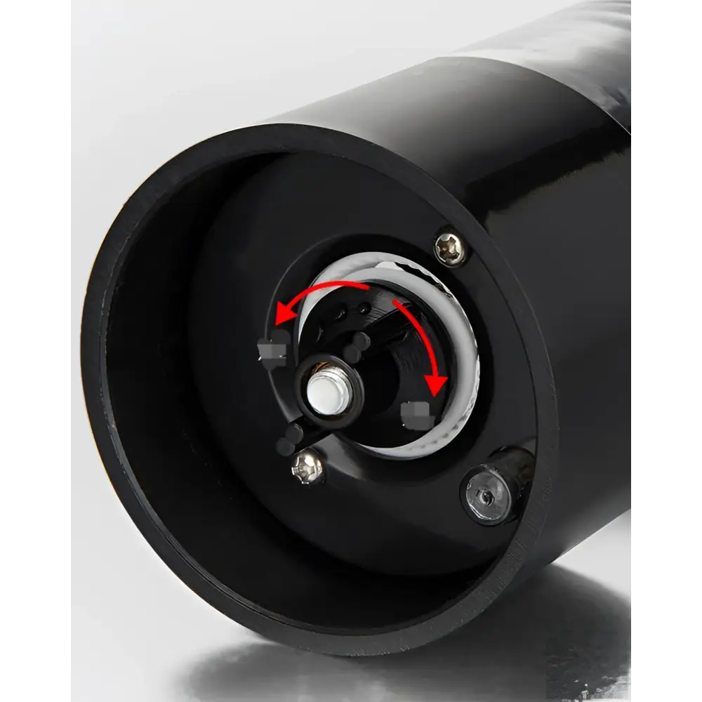 Black cylindrical electric pepper grinder with glossy finish and metallic screws in electric salt–pepper grinder set