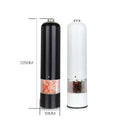 Electric salt–pepper grinder set with black and white models featuring clear view sections showing pink salt and peppercorns