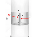 White cylindrical electric salt–pepper grinder with clear central chamber and metallic grinding mechanism in grinder set