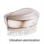 A rose gold electric spray massage comb with white bristles designed for effective hair care spray and scalp massage