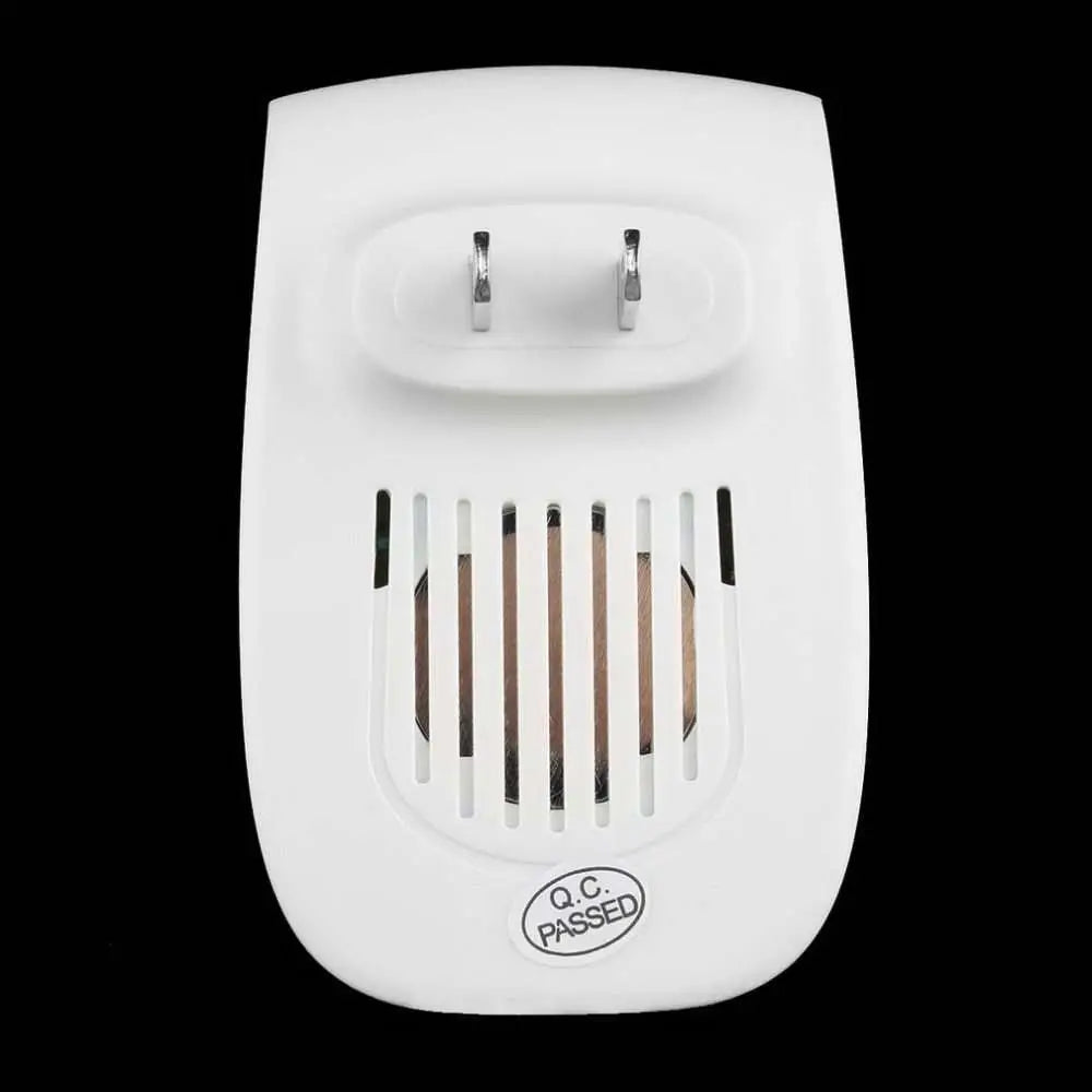 White plastic electronic ultrasonic healthy pest repeller plug with two metallic prongs and ventilation slits