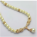 Elegant angel wings pearl necklace with cream pearls and gold diamond clasp featuring a pearl drop