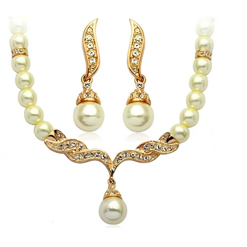 Elegant angel wings gold-toned pearl necklace and earring set with central pendant and sparkling crystal accents