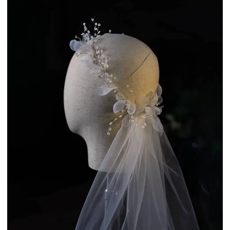 Elegant ivory floral bridal wreath veil adorned with delicate lace and crystal beads for a sophisticated bridal look