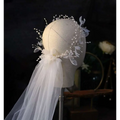 Elegant white floral bridal wreath veil adorned with sheer tulle and sparkling beaded vines for weddings