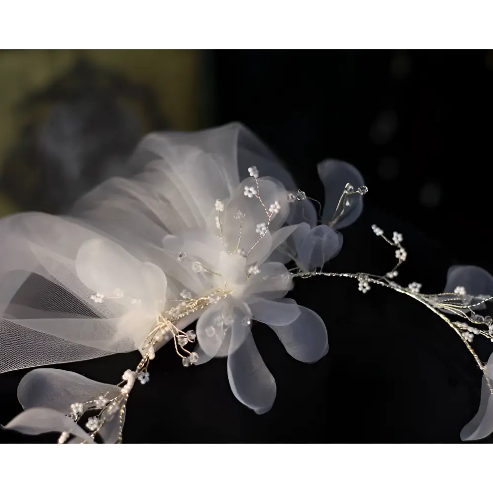 Elegant floral bridal wreath veil in delicate white tulle adorned with sparkling crystals and gold wirework accents