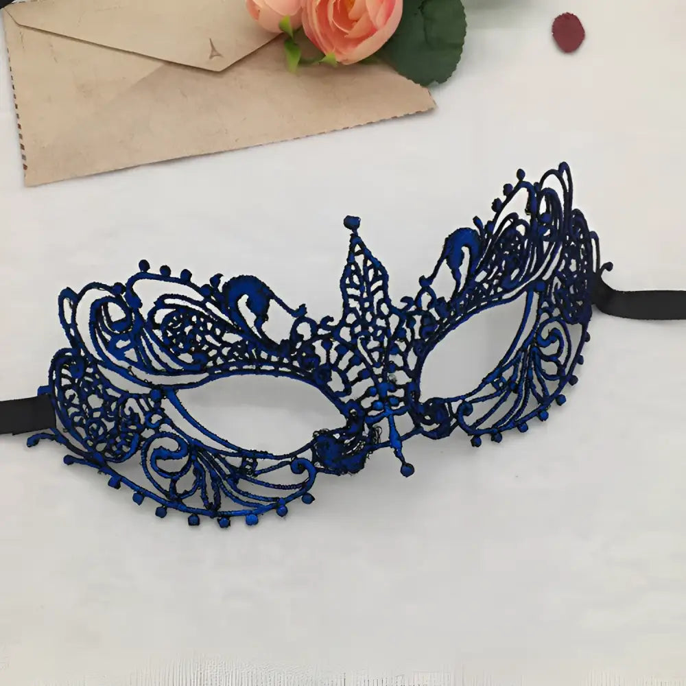 Elegant gold lace mask with intricate filigree design and black elastic straps for pointed Halloween events