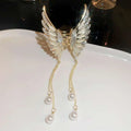 Elegant golden pearl tassel hairpin with gold-toned angel wing clip adorned with rhinestones and dangling pearl drops