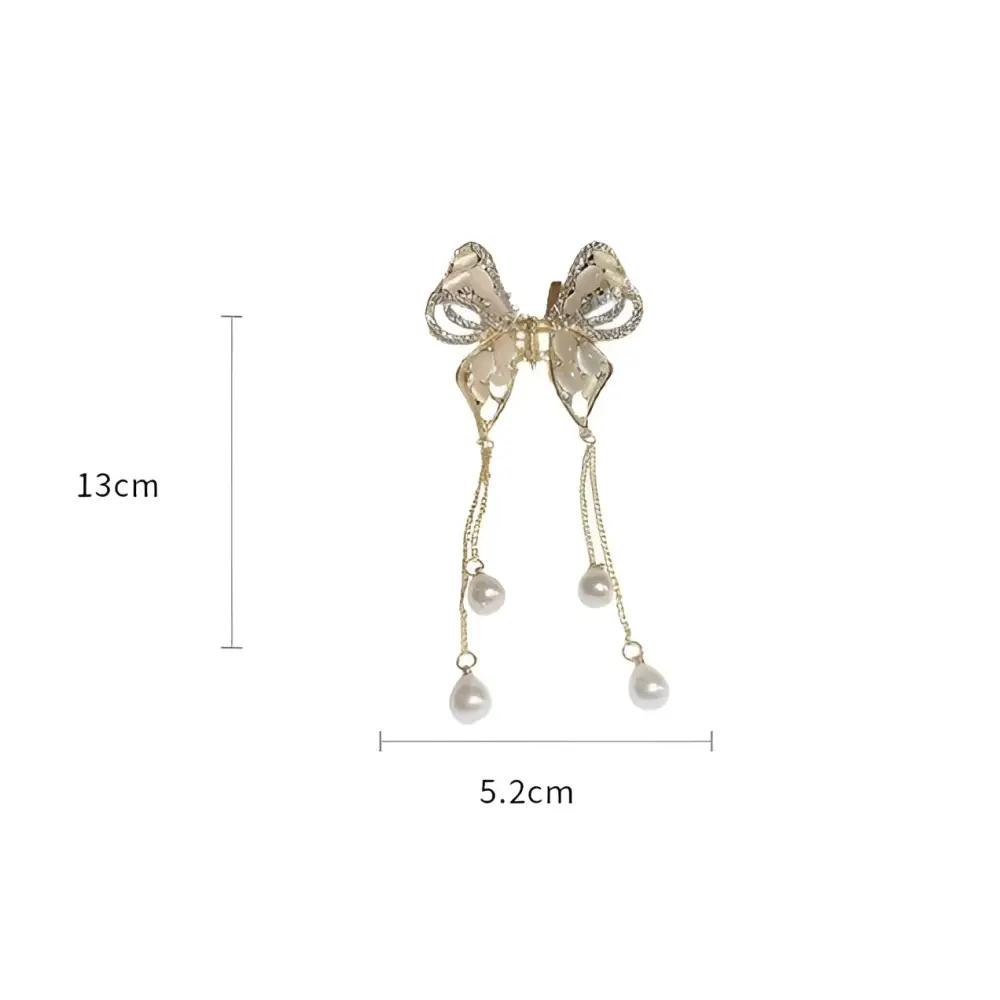 Elegant golden pearl tassel hairpin featuring a gold-toned butterfly with sparkling rhinestones and dangling pearl drops