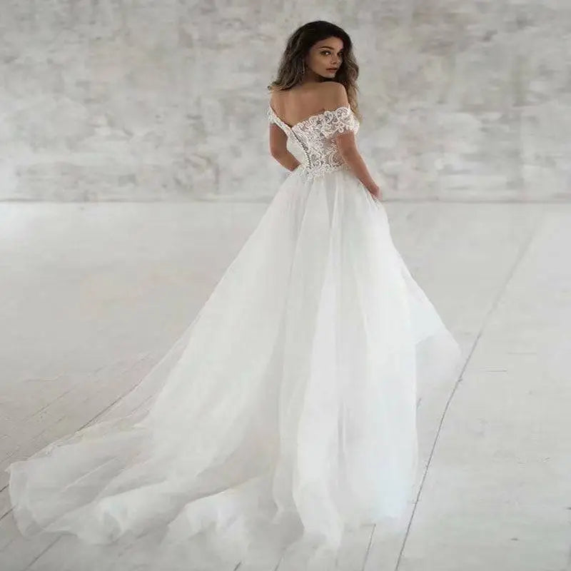 Elegant lace light wedding dress featuring a white off-the-shoulder wedding gown with intricate lace detailing and tulle skirt