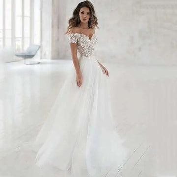 Elegant lace light wedding dress featuring a white off-the-shoulder wedding gown with intricate lace detailing and tulle skirt