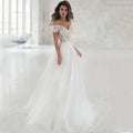 Elegant lace light wedding dress is a white off-the-shoulder wedding gown with intricate lace detailing and a soft tulle skirt