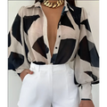 Elegant loose geometric print lantern sleeve sheer blouse in black and beige with puffy sleeves for formal wear