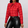 Elegant printed polka dot red long-sleeved bow blouse with black and white polka dots at the neckline