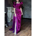 A shimmering magenta satin elegant puff sleeve pleated slit magenta maxi dress with puffed sleeves and a high slit