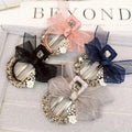 Elegant rhinestone mesh butterfly hairpin with sparkling rhinestones, sheer bows in black, pink, navy, and silver with floral accents