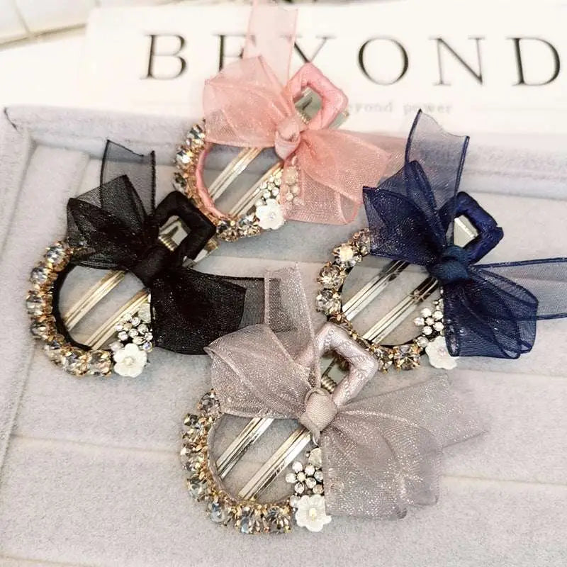 Elegant rhinestone mesh butterfly hairpin with sparkling rhinestones, sheer bows in black, pink, navy, and silver with floral accents