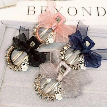 Elegant rhinestone mesh butterfly hairpin with sparkling rhinestones, sheer bows in black, pink, navy, and silver with floral accents
