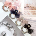 Elegant rhinestone mesh butterfly hairpin featuring pink navy blue and black sheer bows with sparkling rhinestones and floral accents