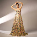 Elegant sleeveless sequined suspender evening dress in champagne with intricate blue red and green floral embroidery