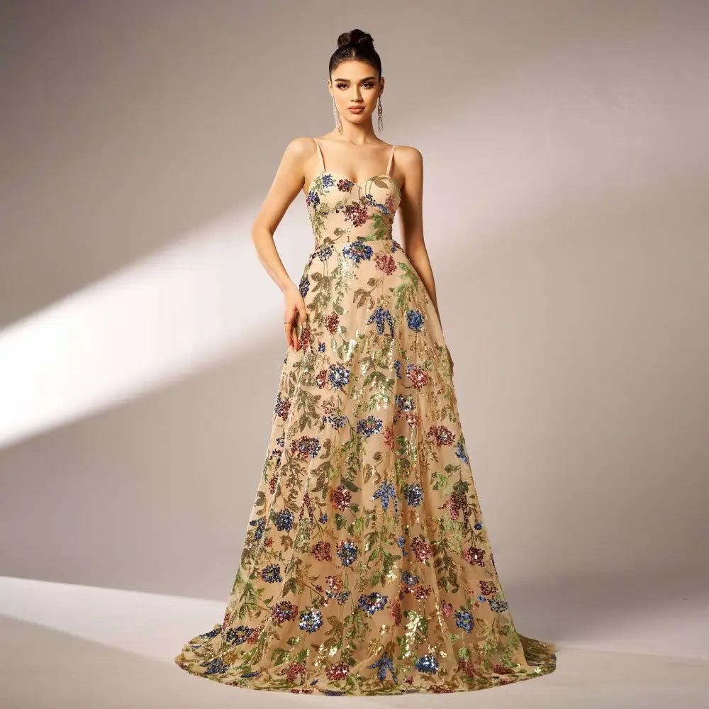Beige elegant sleeveless sequined suspender evening dress with delicate straps and a flowing floor-length silhouette