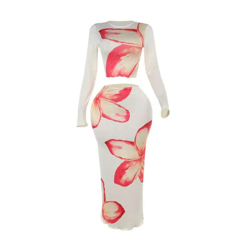 Elegant slim print skirt set featuring a vibrant pink and orange floral two-piece with long-sleeved crop top and high waist skirt