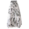 A flowing white mid-length lace mesh skirt with embroidered bow lace featuring intricate black butterfly embroidery