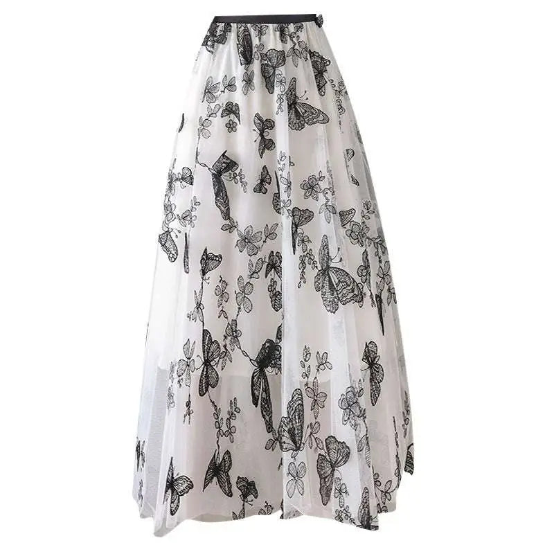A flowing white mid-length lace mesh skirt with embroidered bow lace featuring intricate black butterfly embroidery