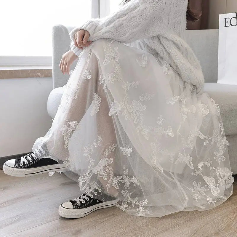 White mid-length lace mesh skirt featuring embroidered bow lace and delicate butterfly embroidery on flowing tulle