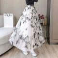 A flowing white lace mesh skirt with embroidered bow lace and intricate black butterfly embroidery mid-length design