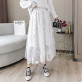 White embroidered bow lace mesh skirt featuring butterfly embroidery in a mid-length floral design