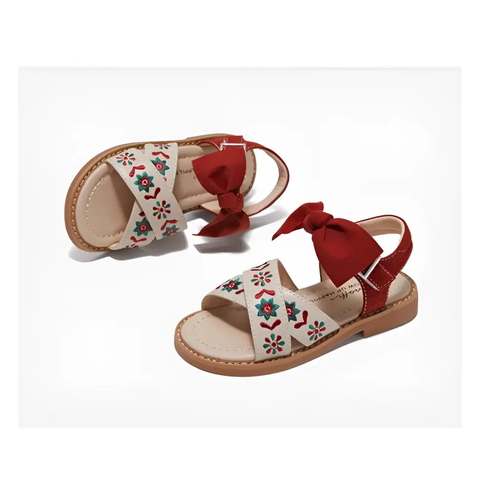 Beige children’s soft-soled sandals with red and green embroidered floral design and red bow ties for big kids