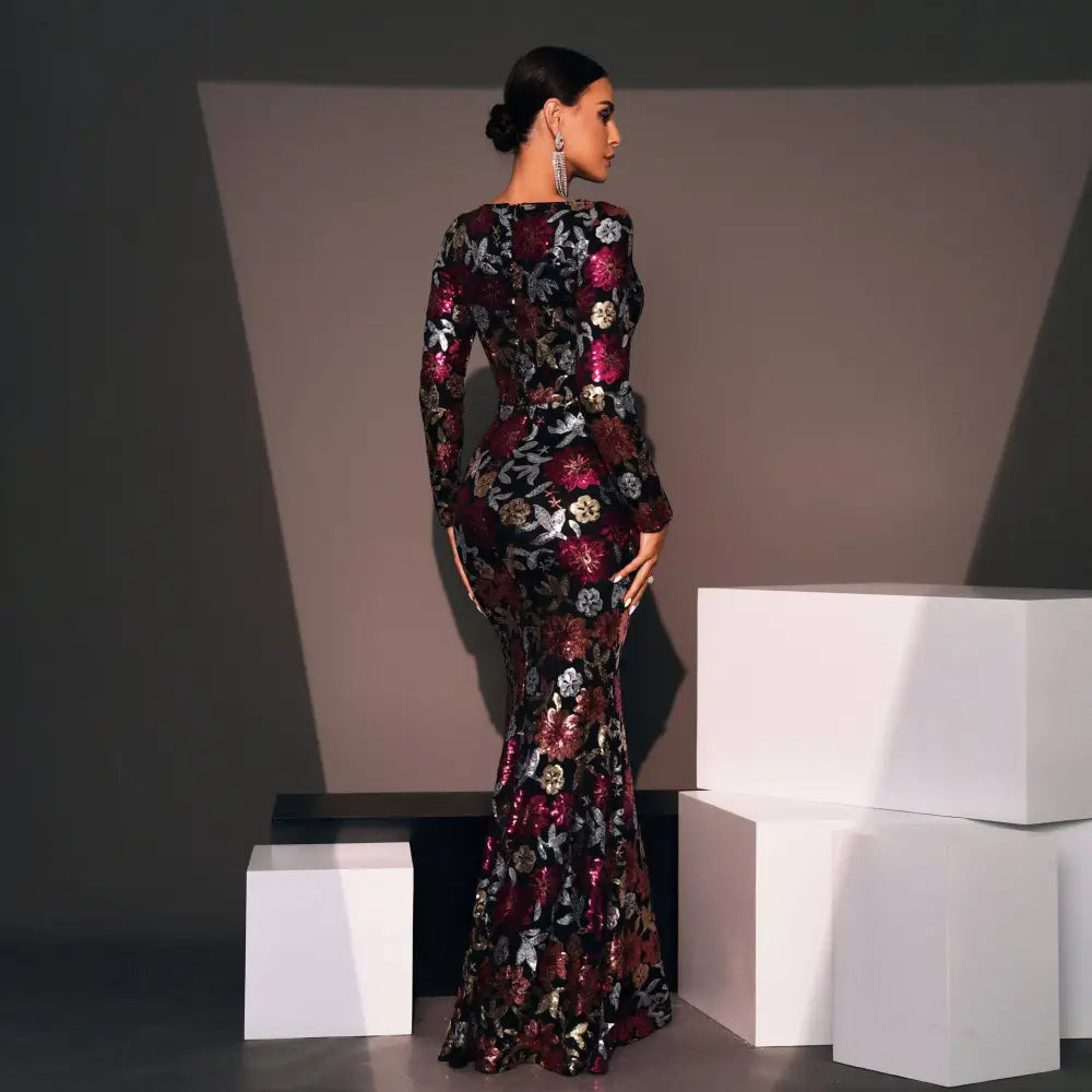 Embroidered floral long sleeve evening gown in deep burgundy and black with metallic gold and silver floral embroidery