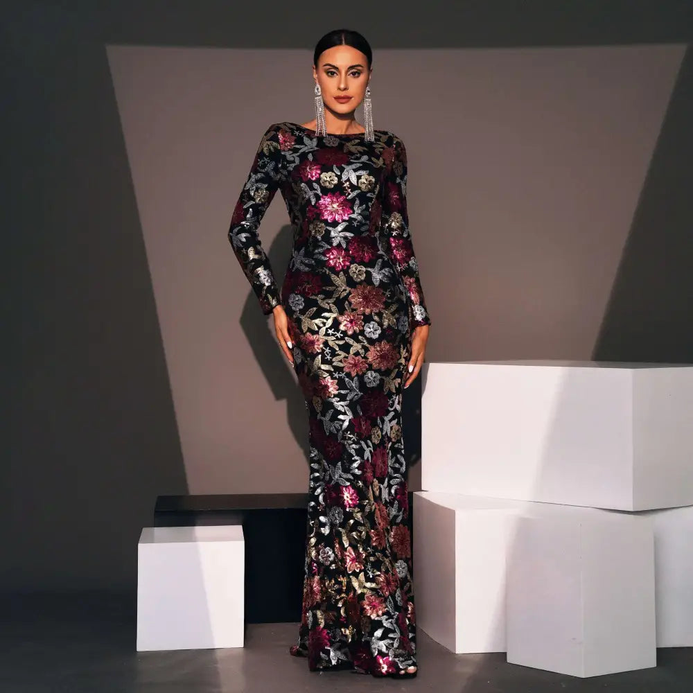 Embroidery floral long sleeve evening gown in black with intricate burgundy and silver floral embroidery floor-length