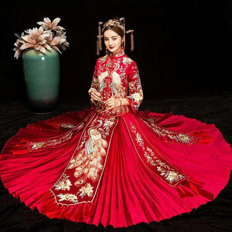 A vibrant red embroidered kimono Chinese wedding couples suit with intricate gold and white peacock embroidery