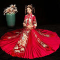 A vibrant red embroidered kimono Chinese wedding couples gown with intricate gold and white peacock embroidery