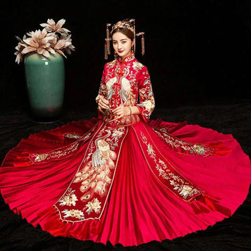 A vibrant red embroidered kimono Chinese wedding couples suit with intricate gold and white peacock embroidery