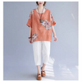 Orange linen top with floral embroidery and short sleeves made from embroidered korean cotton hemp fabric