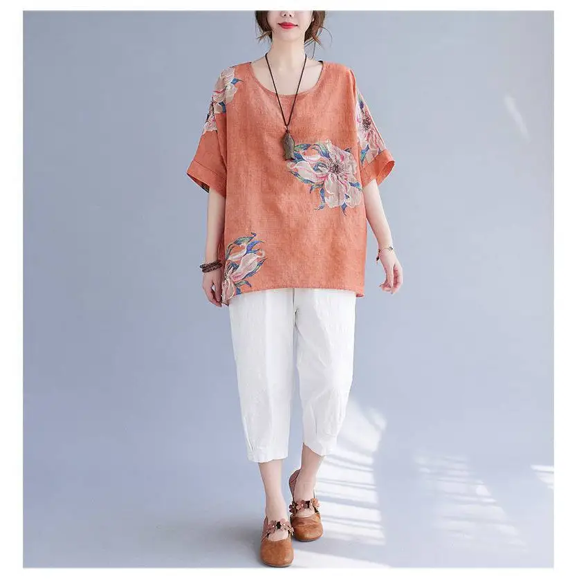 Orange linen top with floral embroidery and short sleeves made from embroidered korean cotton hemp fabric