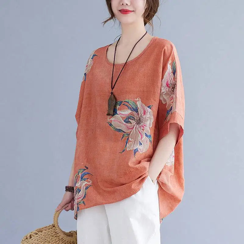 A soft peach embroidered Korean cotton hemp half sleeve top with floral embroidery in pastel pinks blues and greens