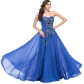 A royal blue strapless chiffon heart collar dress with embroidered peacock heart details in teal and gold