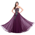 A flowing deep purple strapless chiffon gown with embroidered peacock heart gold and blue embellishments heart collar dress