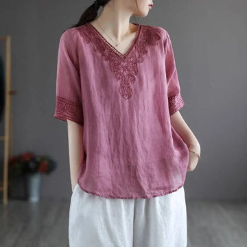 A soft pink embroidered pink fashion retro cotton linen blouse with dark red embroidery on v-neckline and cuffs